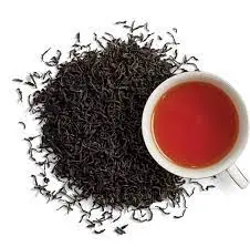 Loose leaf Ceylon black tea with a brewed tea cup